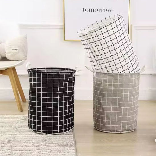 3 panier à linge un noir un gris et blanc l'un dans l'autre