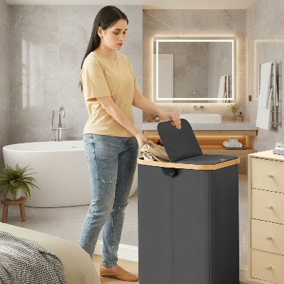 femme d_pose du linge dans le panier a linge 2 compartiment noir