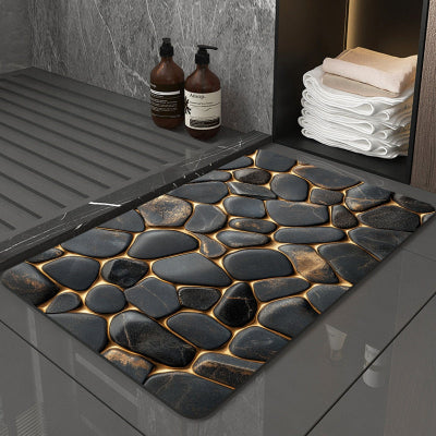 tapis antidérapant pour salle de bain au motif de pierres et quelques serviettes dans une armoire 2 bouteilles au sol